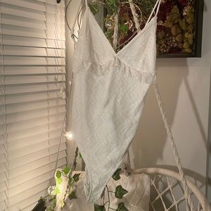 White lace Jumpsuit with button clasp on bottom